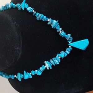 Turquoise colored pendant with turquoise stacked stone and silver beads